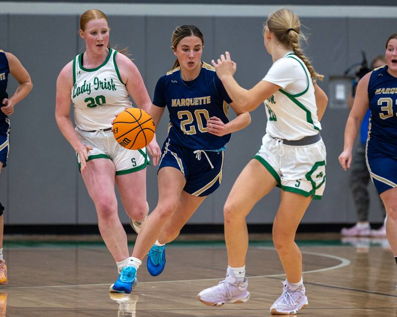 Kaitlyn Davis (20) of Marquette dribbles ball down lane on Monday, November 17, 2025 at Seneca High School in Seneca.