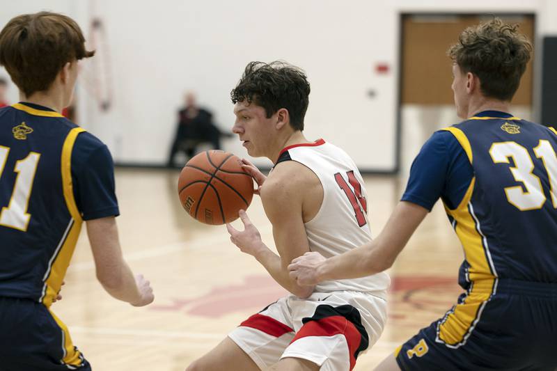 Amboy’s Kyler McNinch looks to pass Wednesday, Jan. 25, 2023 in a game against Polo.