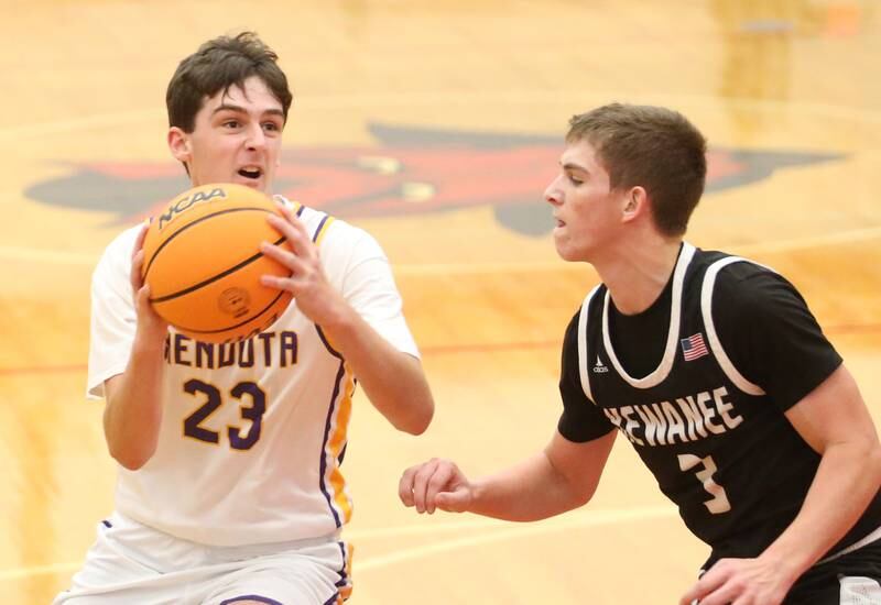 Mendota's Cam Kelly looks to get inside the lane as Kewanee's Greyden Lewis defends during the 50th annual Colmone Classic on Thursday, Dec. 12, 2024 at Hall High School.