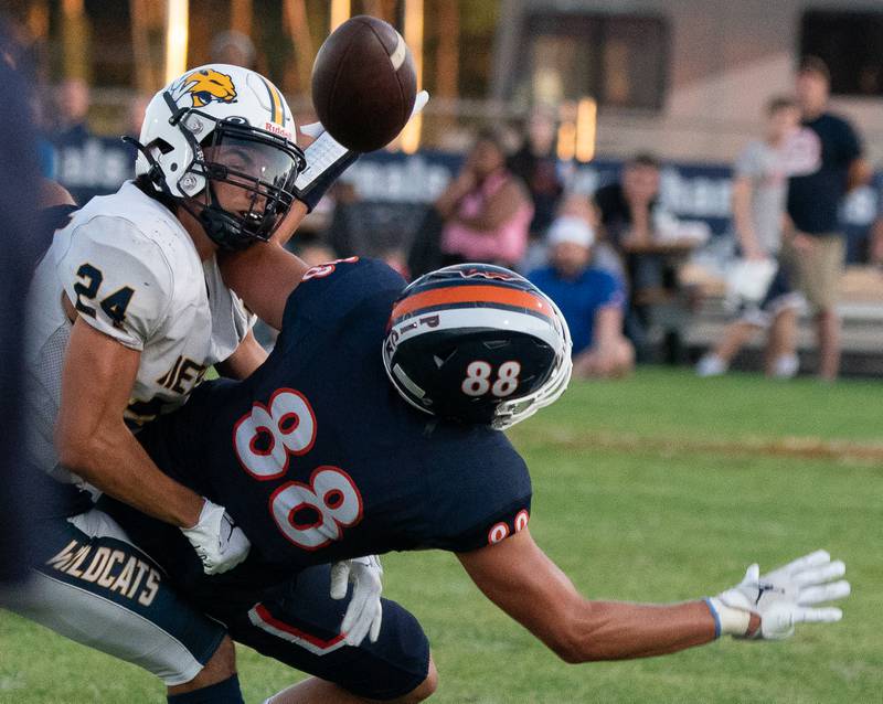 Neuqua Valley's Nicolas Lendino (24) breaks up a pass intended for Oswego’s Deakon Tonielli (88) during a football game at Oswego High School on Friday, Aug 26, 2022.