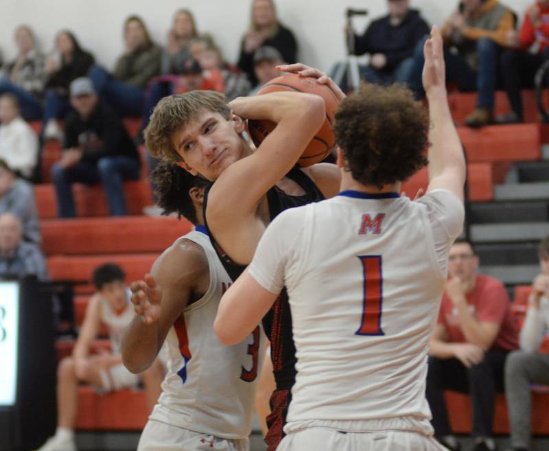 Fulton's Landen Leu rips a rebound away from Morrison players on Saturday, Dec. 30, 2023 at the Warkins Memorial Tournament at Erie High School.