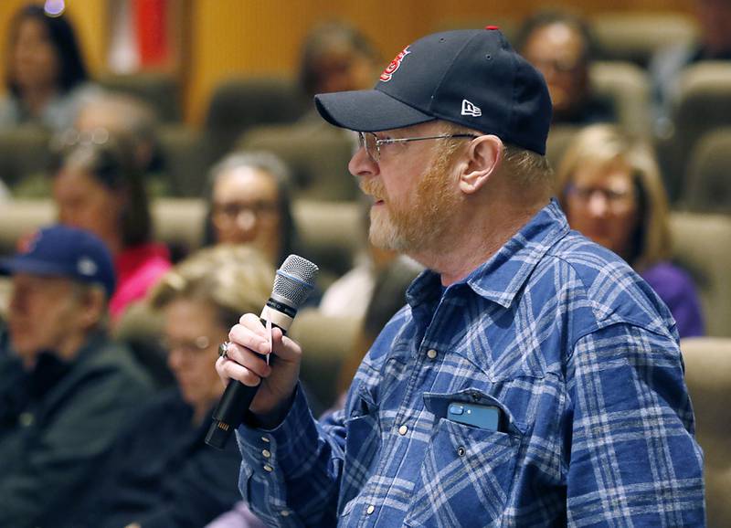 Kevin Rooney of Marengo ask Democratic U.S. Rep. Bill Foster a question during a town hall on Wednesday, April 16, 2025, at McHenry County College's Luecht Auditorium in Crystal Lake.