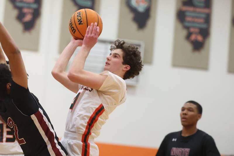 Plainfield East’s Justin Paszkowski puts up a shot against Plainfield North on Tuesday, Jan 14, 2025.