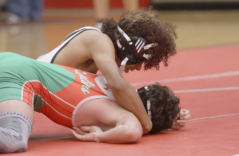 Ottawa's Anthony Juarez wrestles L-P's Jake Mueller during a meet on Thursday Jan. 8, 2026 in Kingman Gymnasium at Ottawa High School.