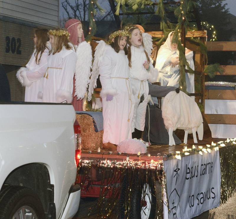Those on the Oglesby Union Church float sang carols Saturday, Dec. 10, 2022, as they rode along Walnut Street during  the Winter Parade.