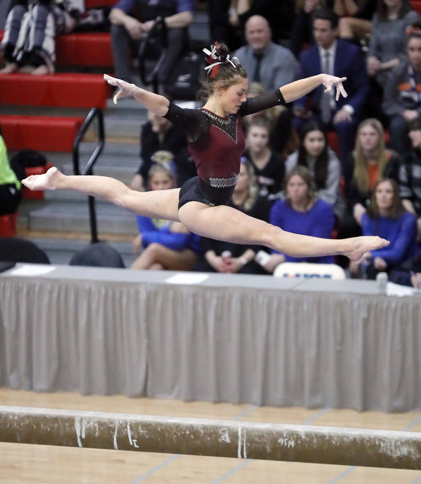 Gabriella Riley of Prairie Ridge competes on the beam during the IHSA Girls Gymnastics state finals Saturday February 18, 2023 in Palatine.