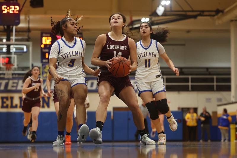 Lockport’s Veronica Bafia goes in for the basket against Joliet Central.