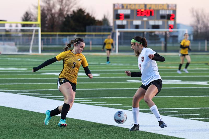Herscher's Avery Jones looks to evade a Bradley-Bourbonnais defender during the Tigers' 3-2 victory over Bradley-Bourbonnais on Tuesday, April 15, 2025.