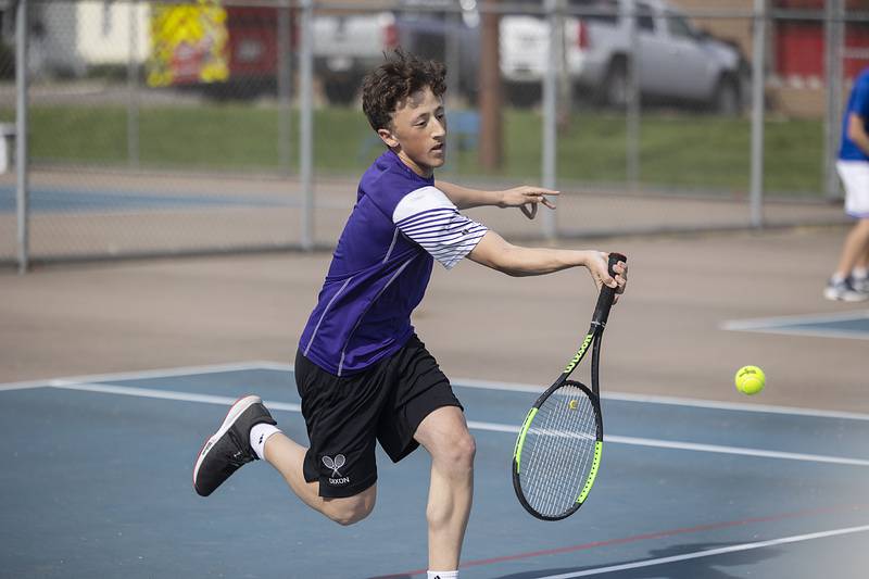 Dixon’s Bashar Elbzour plays a shot against opponent Newman’s Ryan Partington Tuesday, May 9, 2023.