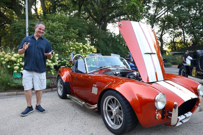 Dan Hall, of Kankakee, talks with fellow car enthusiasts about his 1965 Factory Five Cobra replica during the Cruise-In Night at the Museum on Thursday, Aug. 14, 2025.