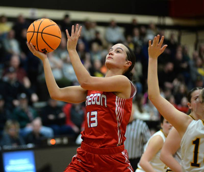 Oregon's Sarah Eckhardt (13) drives in for a layup against Riverdale at the 2A Erie-Prophetstown Regional on Thursday, Feb. 20, 2025.
