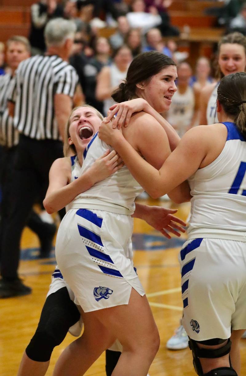 Erin May grabs Princeton teammate Olivia Gartin to celebrate during the Tigresses 35-31 win over rival Bureau Valley Thursday night at Prouty Gym.