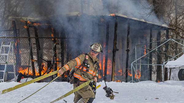 Dixon firefighters battle shed fire