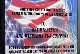 Honor Flight gives plaque to owners and employees of Wiersema Charter Service