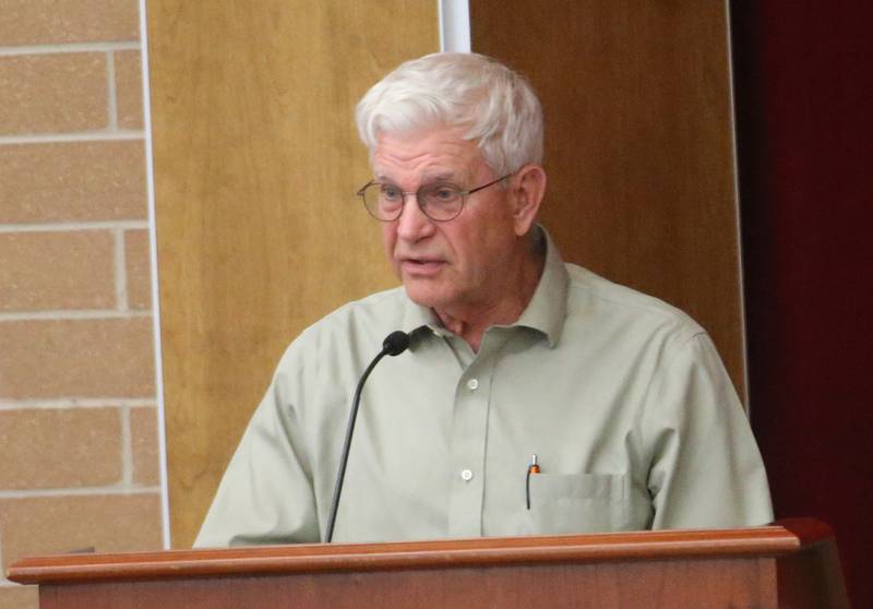 John Fisher speaks to the Illinois Health Facilities and Services Review Board during a public hearing regarding OSF St. Elizabeth Hospital's plans to reduce services on Tuesday, June 10, at Central Intermediate School in Ottawa.