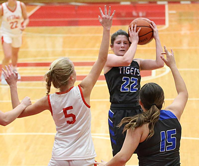 Princeton's Miyah Fox (right) looks to pass the ball to her teammate Isa Ibarra (right) as Ottawa's Grace Carroll (left) defends the lane on Thursday, Dec. 15, 2022 at Kingman Gymnasium in Ottawa.