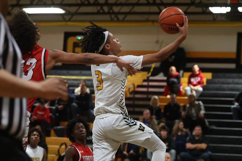 Joliet West’s Tristian Saunders goes in for the layup against Yorkville on Friday, Jan. 5th, 2024. in Joliet.