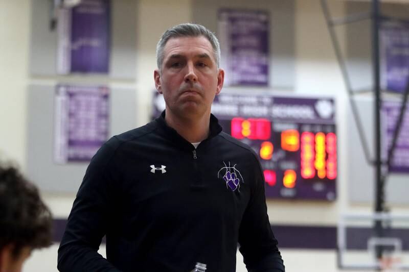 Hampshire’s coach Mike Featherly walks courtside as the Whip-Purs face Huntley in boys basketball at Hampshire on Friday.