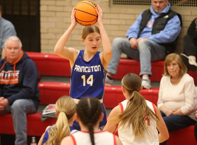 Princeton's Payton Brandt looks to pass the ball around Ottawa defenders on Monday, Feb. 3, 2025 in Kingman Gymnasium at Ottawa High School.