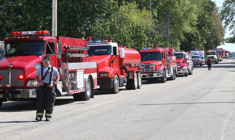 Dozens of tanker trucks fill Main Street in McNabb to respond to a fire at Grassers Heating and Plumbing on Wednesday, Sept. 17, 2025 in McNabb. The fire began shortly before 10a.m. A Mutual Aid Box Alarm System (MABAS) was elevated to the fourth-alarm. No one was injured in the fire. Fire departments from McNabb, Peru, Utica, Henry, Ladd, Hennepin, Granville, Oglesby, Spring Valley, Leonore, Troy Grove, Seatonville, Wenona, Standard, Lacon-Sparland, Bureau and Tonica all responded to the scene. Firefighters left the scene at 11:30a.m.