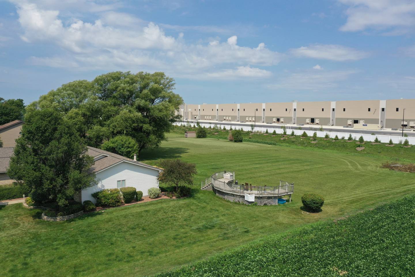 An aerial view of a home next to one of NorthPoint distribution centers near the intersection of Noel Road and Illinois Route 53 in Elwood. NorthPoint is developing the Third Coast Intermodal Hub, a warehouse development of more than 2,000 acres stretching from Joliet to Elwood.