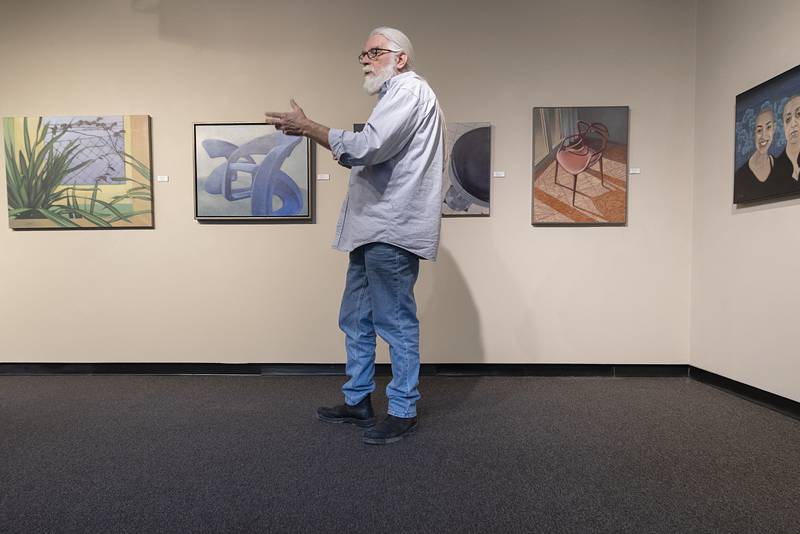 Sauk Valley Community College art department head Glenn Bodish introduces artist Deborah Di Vita Glascott, who was on hand to close out her exhibit “13 Stories” at the SVCC art gallery.