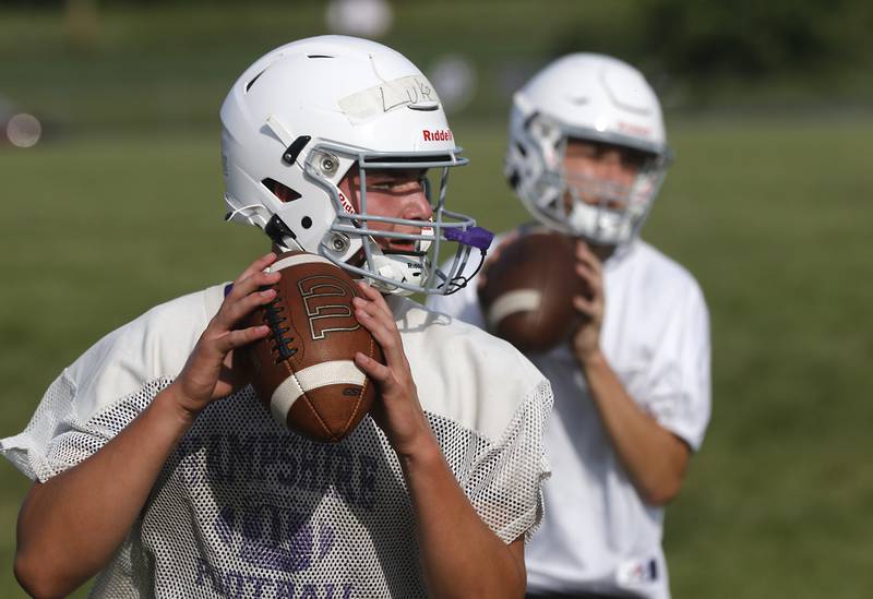 Hampshire’s Luke Lacke drops back to pass during the first day of football practice Monday, August 7, 2023, at Hampshire High School.