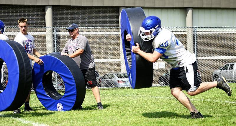 Dundee-Crown senior tight end Tommy Warner practices tackling Thursday, July 20, 2017, in Carpentersville.