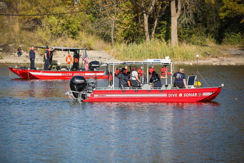 Sonar crews search for a missing person in the Fox River in McHenry.
