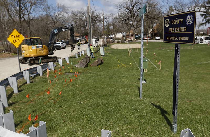 Workers for the Nunda Township highway department, remove a guard rail on Tuesday, April 15, 2025, as they begin to install a parking lot and park. Mike Lesperance,  the outgoing Nunda Township Highway Commissioner, is  build a park and parking lot next to a township bridge over the Fox river on Rawson Bridge Road in Cary.