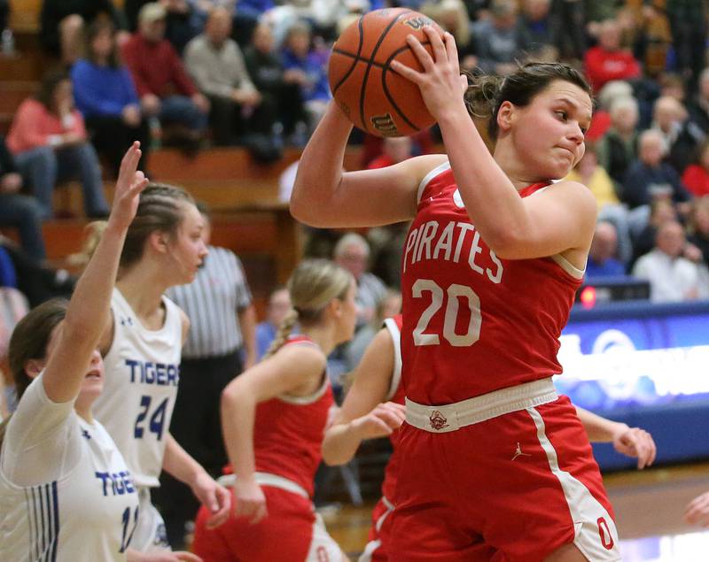 Ottawa's Kendall Lowery grabs a rebound over Princeton's Jordan VandeVenter on Monday, Feb. 5, 2024 in Prouty Gym.