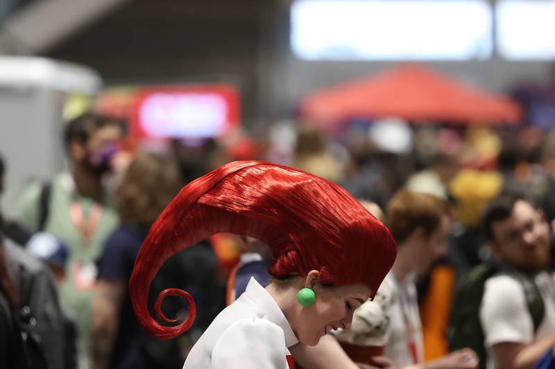 A person dress as a Team Rocket character, from the Pokemon series, walks along the show floor at C2E2 Chicago Comic & Entertainment Expo on Sunday, April 2, 2023 at McCormick Place in Chicago.