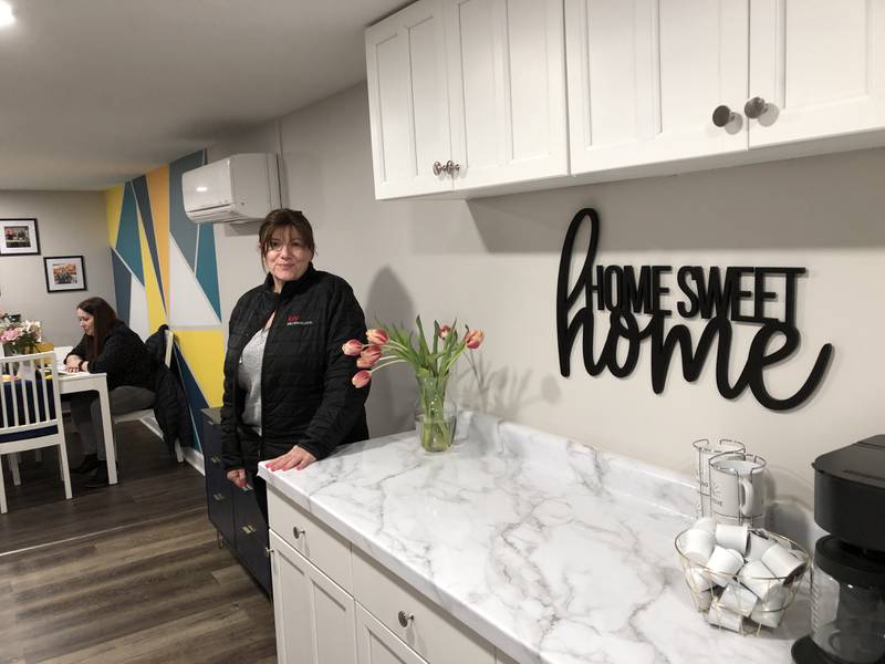 Dawn Bremer, of Bremer Team – Keller Williams Success Realty in McHenry, gives a tour of the new concierge suite on Monday, March 25, 2024. The space allows clients a place to work and bring pets and family when showings force them from their homes.