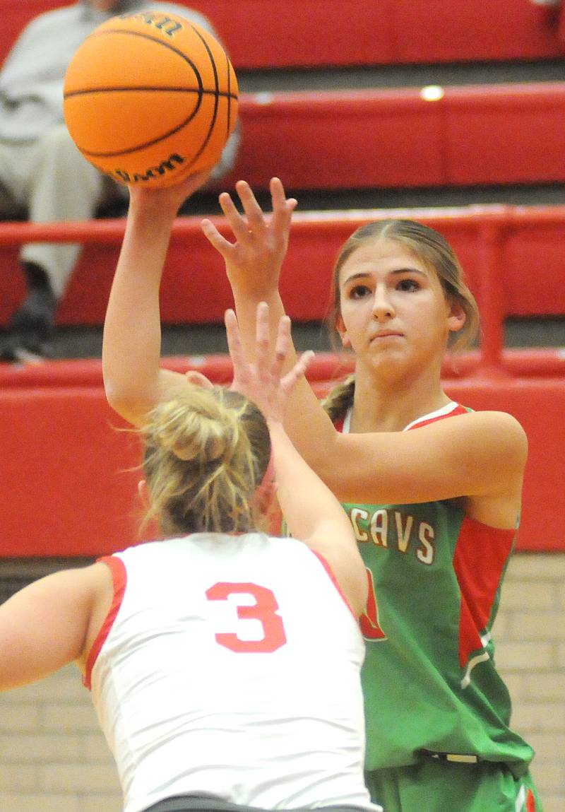 La Salle-Peru's Kelsey Frederick raises the ball as Ottawa's Skyler Dorsey on Friday, Dec. 13, 2024, at Kingman Gym.