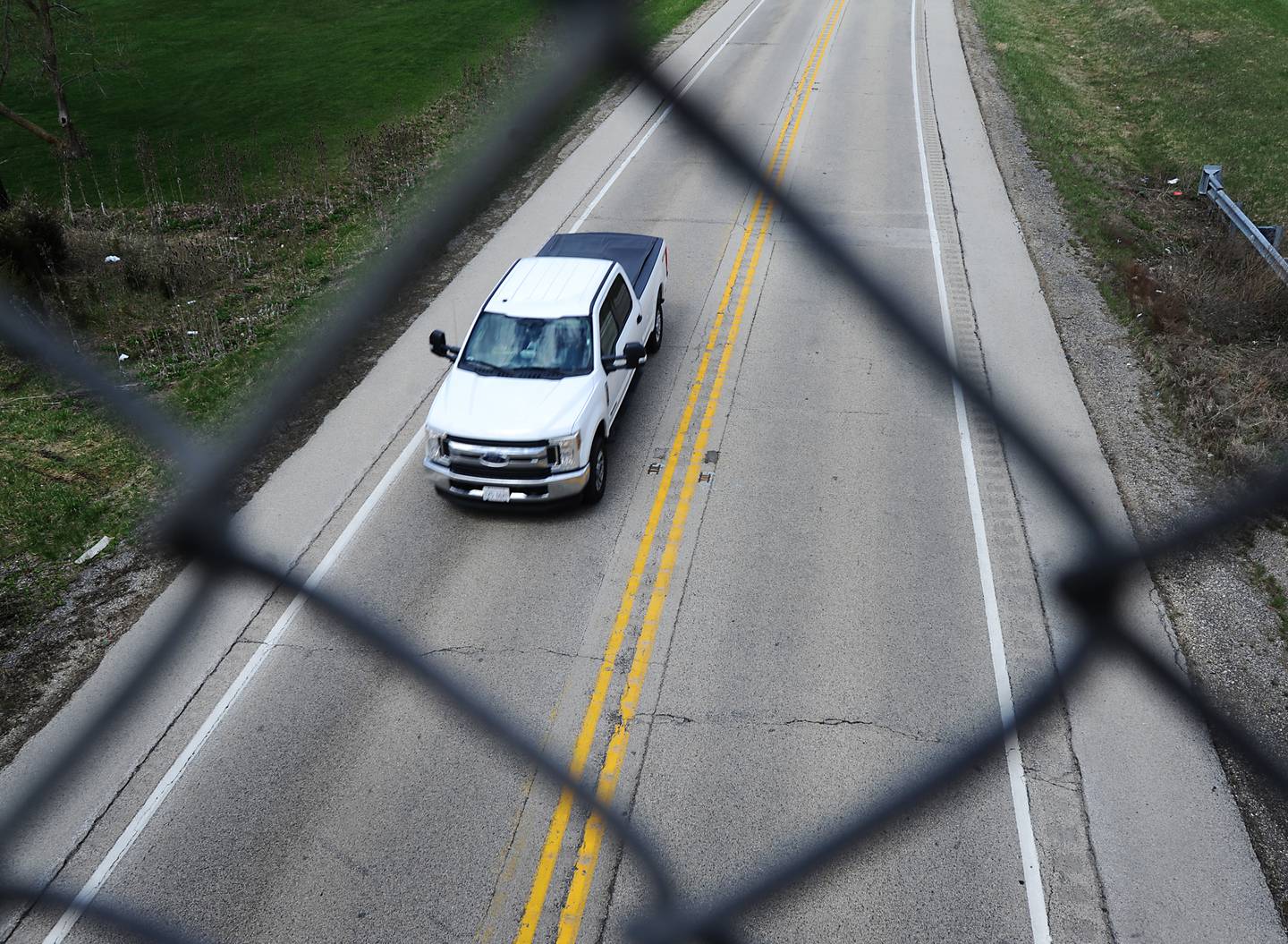 A pickup truck travels U.S. Route 14 on Tuesday, April 26, 2022, near West South Street in Woodstock. The Illinois Department of Transportation is resurfacing a nearly six-mile stretch of U.S. Route 14, running west from Hughes and Hartland roads to IL Route 47. The road is a popular route from Woodstock to Harvard and into Wisconsin.