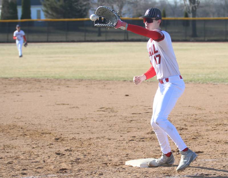 Hall's Clayton Fussinetti makes the catch at first base to force out a Putnam County player on Monday, March 17, 2025 at Putnam County High School.