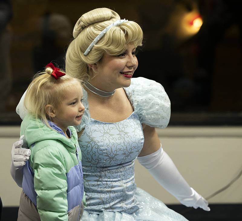 Hazel Humphrey, 2, has her picture taken with Cinderella Friday, Dec. 6, 2024, in Dixon.