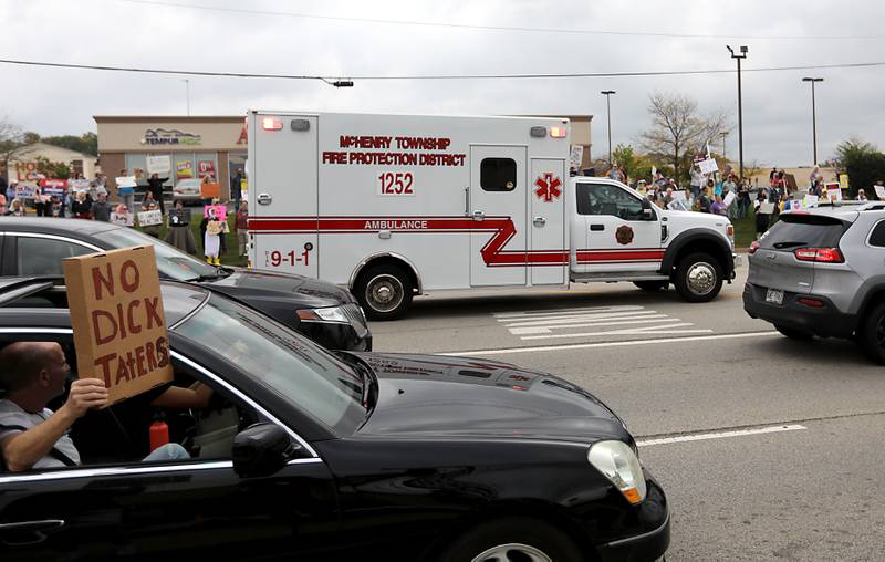 A rescue squad travels on Route 31, during a "No Kings” protest rally on Saturday, Oct. 18, 2025, in McHenry. The protest drew thousands of protesters to the area to protest the policies of President Donald Trump.