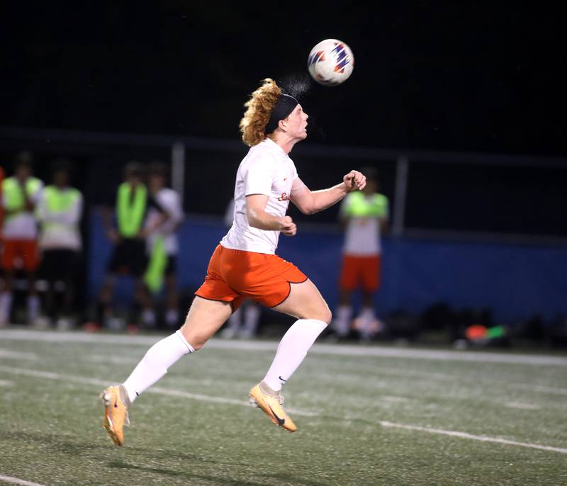 St. Charles East’s Jake Walker heads the ball during a game at Geneva on Tuesday, Oct. 3, 2023.
