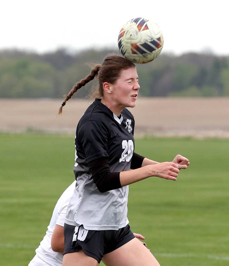 Kaneland's Erin Doucette goes up for a header in front of Sycamore's Anya Berry Wednesday, April 30, 2025, during their game at Kaneland High School in Maple Park.