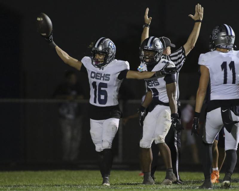 Oswego East's Donavin Eason (16) reacts after catching a long touchdown during football game between Oswego East at Oswego Friday, Oct 17, 2025 in Oswego.