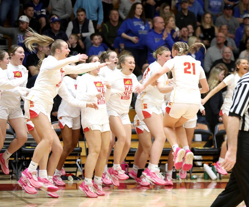 Batavia players celebrate their Class 4A Batavia Sectional final win over Geneva on Thursday, Feb. 22, 2024.