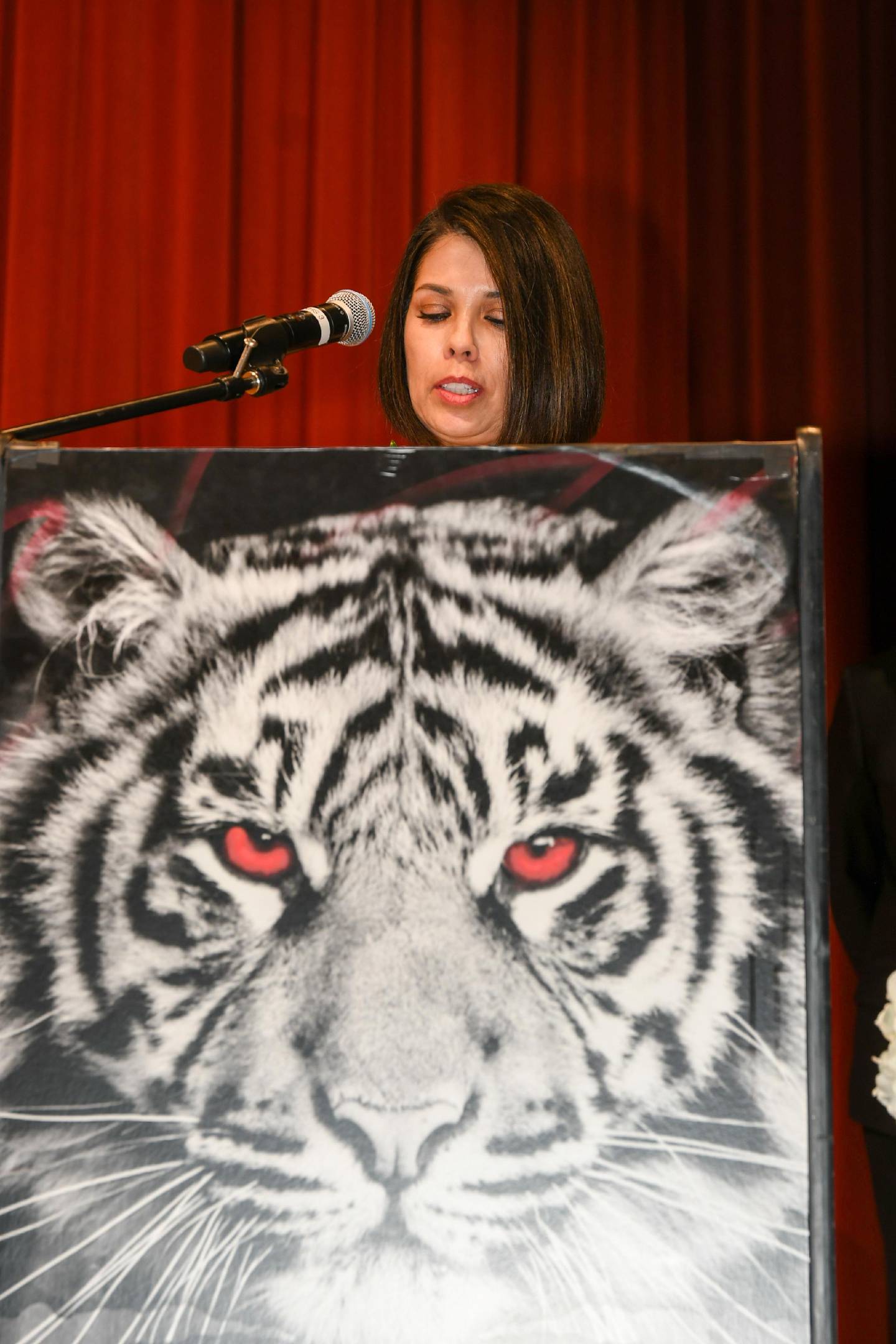 Tina Vasquez, paraprofessional at Bonnie McBeth Early Learning Center, speaks during the District 202 Board of Education Awards of Excellence on Thursday, April 9, 2026, in Plainfield. Vasquez earned a Crystal Apple Award of Excellence for her work with veterans and connecting them with District 202.