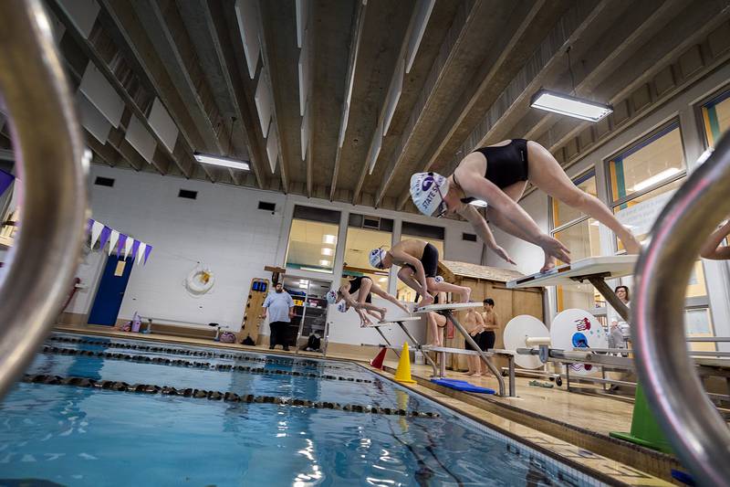 Swimmers practice their starts Monday, March 4, 2024 at the Dixon YMCA.