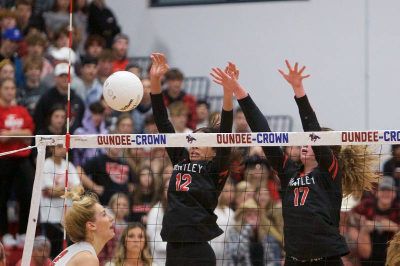 Huntley's Morgan Jones (12) and Georgia Watson (17) 2ith the block against Barrington 
at the Class 4A Super Sectional Final on Friday, Nov. 4,2022 in Dundee.