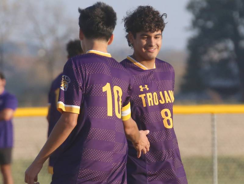 Mendota's Johan Cortez hi-fives teammate Ramiro Palacios after scoring a goal against Princeton during the Class 1A Regional final game on Tuesday, Oct. 22, 2024 at Serena High School.