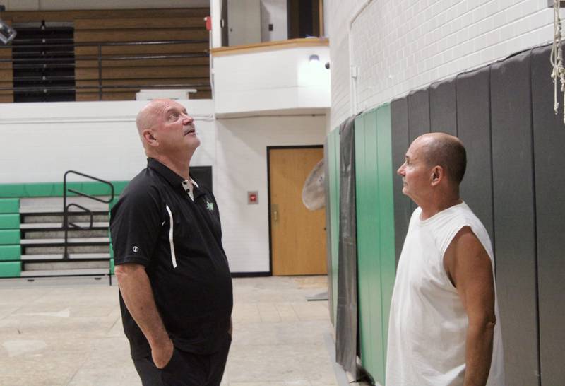 Rock Falls High School board of education Vice President John Howard talks with facilities director Bryan Berogan about the improvements made to Tabor Gymnasium during a tour of the facility on Wednesday.