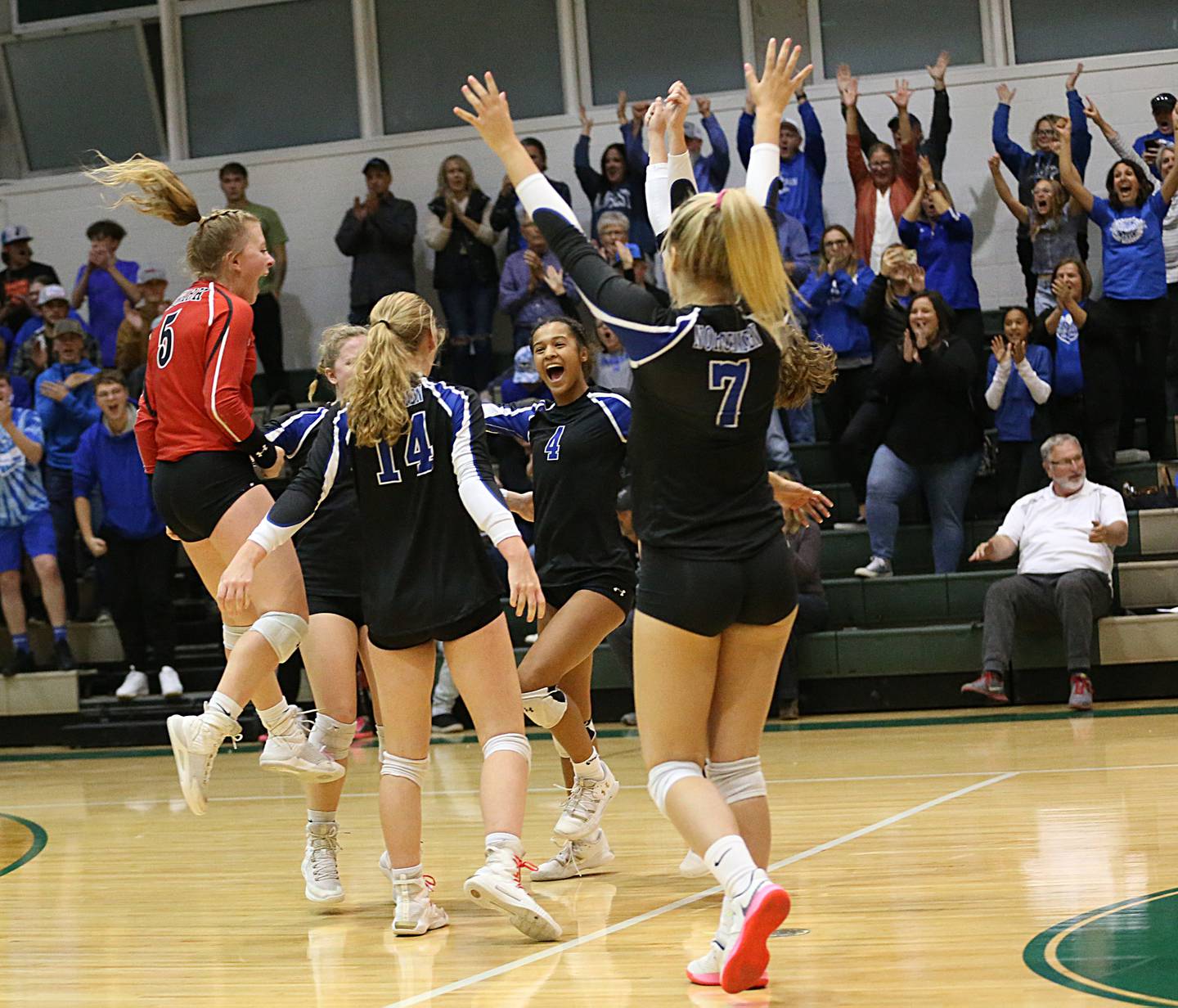 Members of the Newark volleyball team react after winning the 1A Regional final game against St. Bede on Thursday, Oct. 27, 2022 at the Academy in Peru.