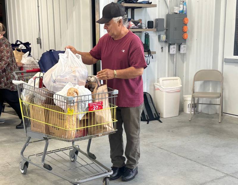 Jose Ontiverus volunteers at the Hall Township Food Pantry on Wednesday, June 12, 2024 in Spring Valley.