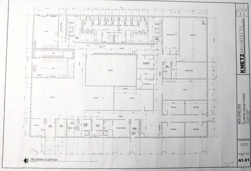 A view of the blueprint that consists a 11,238 square foot building on the existing property of the Illinois Valley Public Action To Deliver Shelter (PADS) on Wednesday, Feb. 1, 2023 in Ottawa. The plans include the current building to be demolished. The approximate cost of the new building project will be 3.5 million. The current Ottawa shelter is housed in a 165 year-year-old building with problems that include inadequate space and extensive temperature control issues. The space of the facility tightly houses 55 individuals and is currently full. Funding for the project will begin soon. Alcorn hopes that construction will begin within the next few years or sooner.